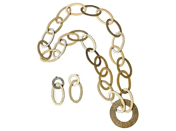 Fabuloso conjunto modelo DOLCE & GABBANA “Whisp” en acero dorado 