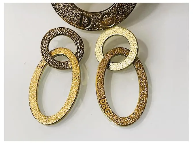 Fabuloso conjunto modelo DOLCE & GABBANA “Whisp” en acero dorado 