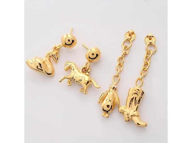 PENDIENTES DE STUD MULTIENCANTO CHAPADOS EN ORO MARNI DORADO 